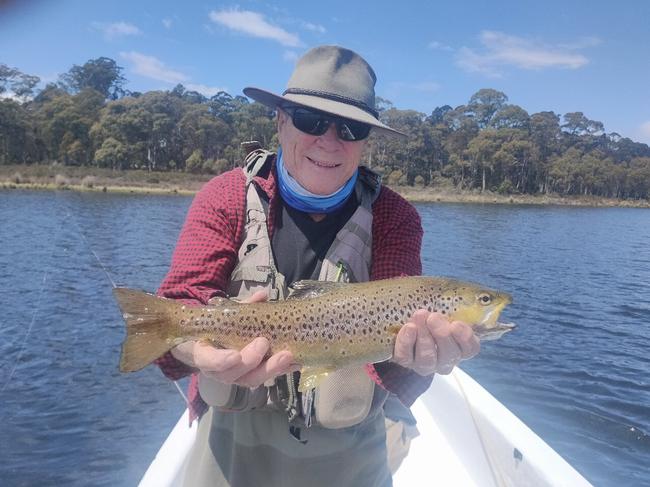 Charles Wooley with a fine trout he caught in London Lakes. Picture Supplied