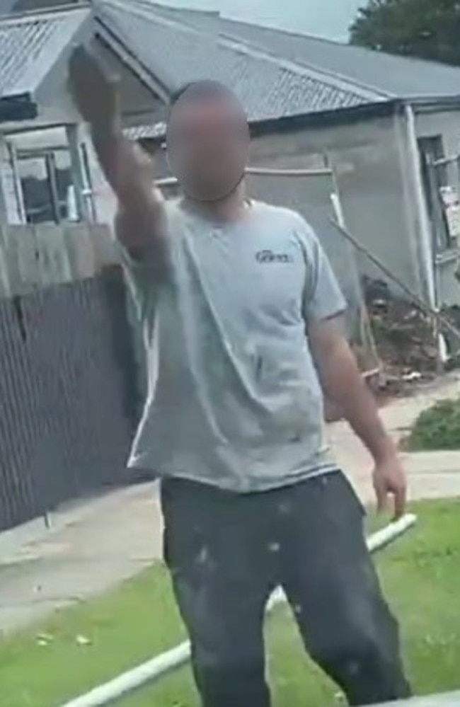 A still taken from a video where a man performs what appears to be a Nazi salute.