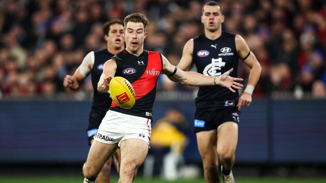 Zach Merrett had a big influence despite close checking from Ed Curnow and the Blues. Picture: Dylan Burns/AFL Photos