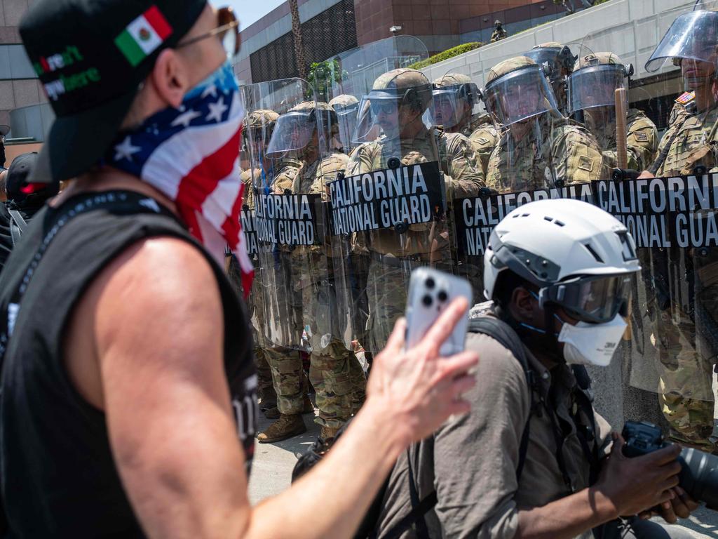 The National Guard, police and protesters stand off outside a downtown jail in Los Angeles. Picture: Getty Images via AFP