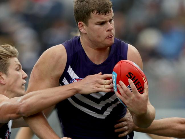 GEELONG, AUSTRALIA - JUNE 25: Sean Darcy of the Dockers is challenged by Rhys Stanley and Steven Motlop of the Cats during the round 14 AFL match between the Geelong Cats and the Fremantle Dockers at Simonds Stadium on June 25, 2017 in Geelong, Australia.  (Photo by Robert Cianflone/Getty Images)