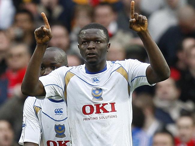 Portsmouth's player Sulley Muntari celebrating after scoring from the penalty spot against Manchester United during their English FA Cup quarter final soccer match at Old Trafford Stadium, Manchester, England 08 Mar 2008 (AP Photo/Jon Super) **NO INTERNET/MOBILE USAGE WITHOUT FOOTBALL ASSOCIATION PREMIER LEAGUE(FAPL)LICENCE. EMAIL info@football-dataco.com FOR DETAILS.