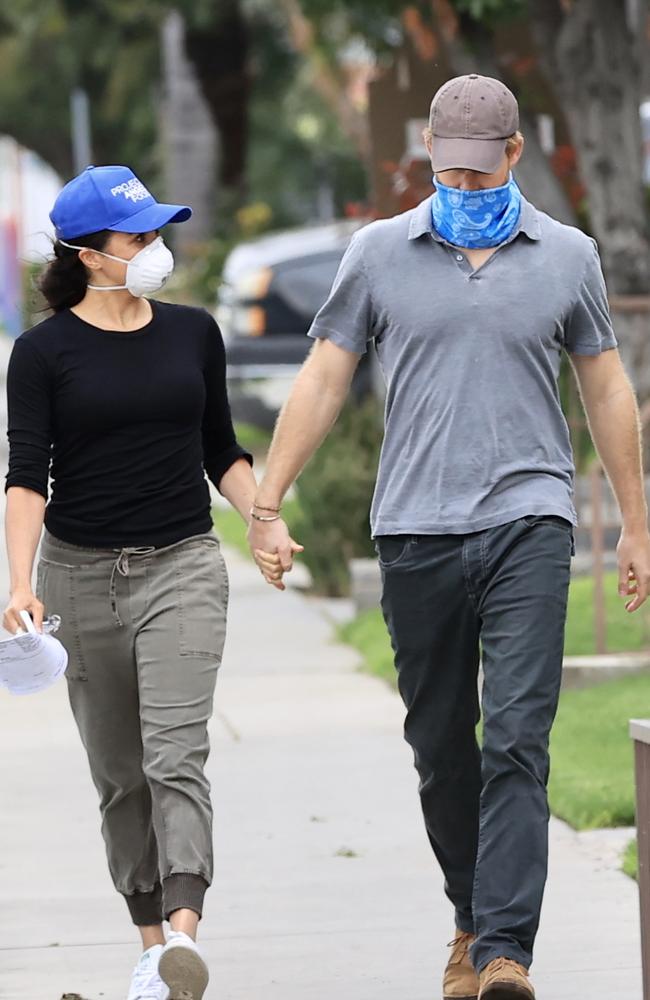 Harry and Meghan were seen in LA this week wearing masks as they delivered meals to residents in need during the COVID-19 pandemic. Picture: MEGA