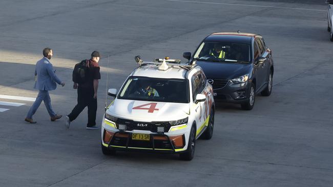 Bali Nine heroin trafficker Martin Stephens is helped into a car after arriving at Sydney airport. Picture: John Feder/The Australian