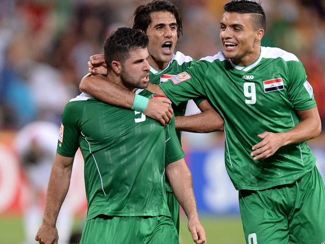 BRISBANE, AUSTRALIA - JANUARY 12: Yaser Safa Kasim of Iraq celebrates with team mates after scoring a goal during the 2015 Asian Cup match between Jordan and Iraq at Suncorp Stadium on January 12, 2015 in Brisbane, Australia. (Photo by Bradley Kanaris/Getty Images)