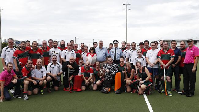 The Queensland Police and Emergency services team and Redcliffe Red Schwarz team pose with Deputy Commissioner Steve Gollschewski, Heather Forte, Stuart Forte (parents of Brett Forte) and match officials after the Brett Forte memorial hockey match played at the Mary Nairn Fields, Redcliffe, Saturday, October 6, 2018. Picture: AAP /Regi Varghese