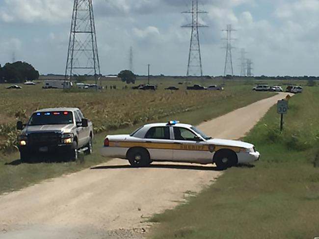 A police vehicle blocking a road where a hot air balloon crashed near Lockhart, Texas.  Picture:  AFP