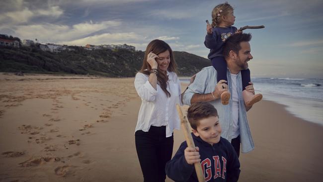 Jason and Megan van Genderen with their children Art, 7, and Evie, 3, on their local beach.