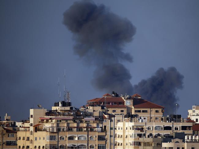 Smoke billows from a building hit by an Israeli air strike in Gaza City, yesterday. Picture: AFP Photo/Thomas Coex