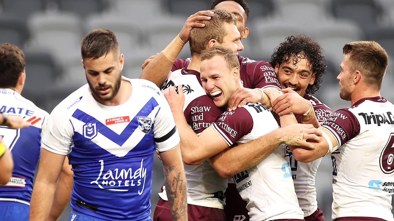 SYDNEY, AUSTRALIA - JULY 03: Tom Trbojevic of the Sea Eagles celebrates with his teammates after scoring a try during the round 16 NRL match between the Canterbury Bulldogs and the Manly Sea Eagles at Stadium Australia, on July 03, 2021, in Sydney, Australia. (Photo by Mark Kolbe/Getty Images)