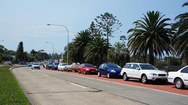 Cr Vincent De Luca wants two-hour parking restrictions implemented to bring a halt to the weekend car mart at Collaroy, seen here adjacent to Griffith Park. Picture: Supplied