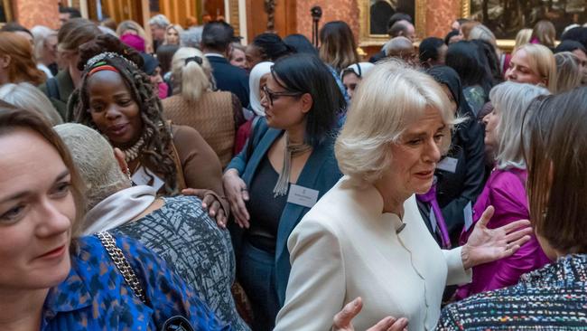 Britain's Queen Consort Camilla (right) speaks to guests near Ngozi Fulani (back left) during a reception to raise awareness of violence against women and girls at Buckingham Palace. Picture: AFP