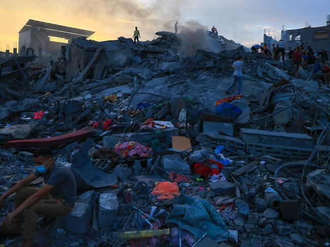 Palestinians search for survivors in the rubble of a building in the Nuseirat refugee camp, in the central Gaza Strip. Picture: AFP