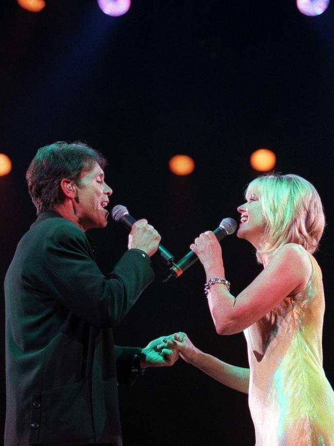 Singer Sir Cliff Richard on stage at Adelaide Entertainment Centre with the late Olivia Newton-John during a concert in 2008.