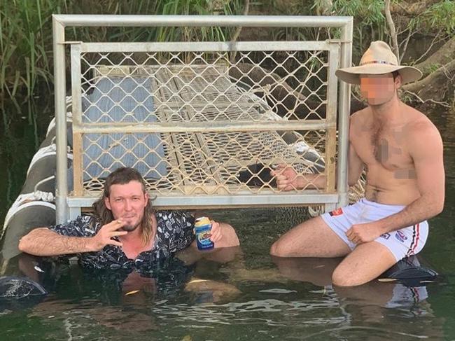 Tim and his mate decided it was a great idea to pose in front of a croc trap on the Katherine River near Nitmiluk Gorge. Picture: Supplied