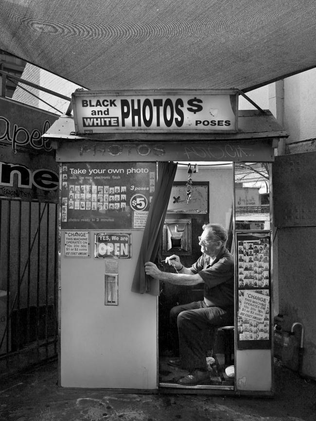 Alan Adler servicing a similar photo booth in Chapel Street, South Yarra. Picture: Valeriu Campan