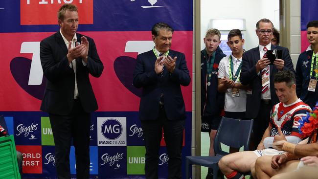 Nick Politis, centre, in the sheds following the Roosters’ grand final triumph last year. Picture: Brett Costello