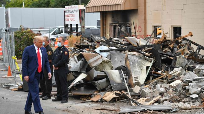 US President Donald Trump tours an area affected by civil unrest in Kenosha, Wisconsin on September 1.