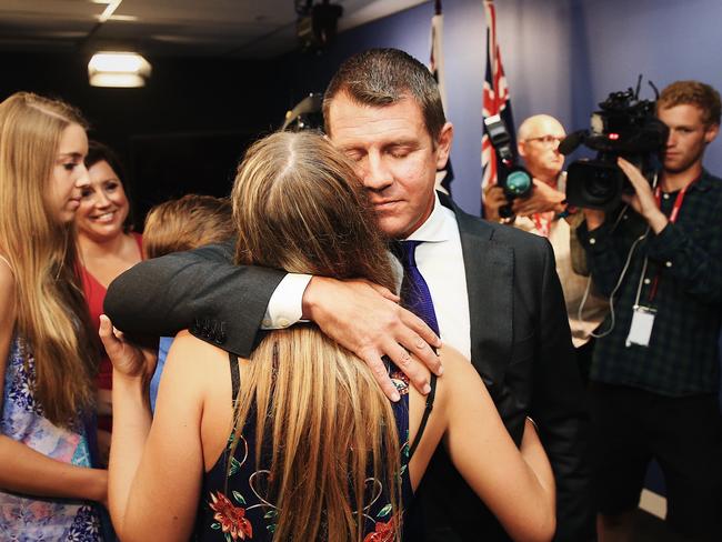 Premier Mike Baird embraces his family after announcing his retirement. Picture: Dylan Robinson