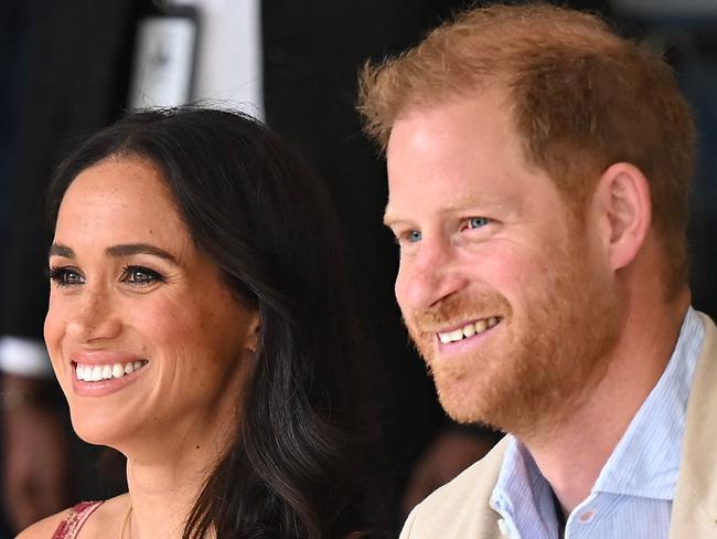 Britain's Prince Harry (R), Duke of Sussex, and his wife Meghan Markle are pictured during a visit to the National Centre for the Arts in Bogota on August 15, 2024. Prince Harry and his wife, American actress Meghan Markle, arrived in Colombia at the invitation of Marquez, with whom they will attend various meetings with women and young people to reject discrimination and cyberbullying. (Photo by RAUL ARBOLEDA / AFP)