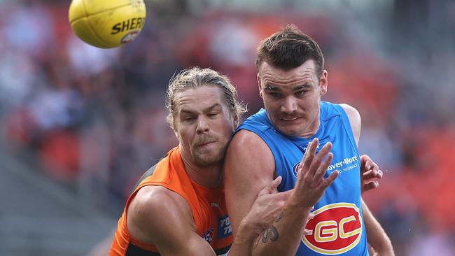 Harry Himmelberg of the Giants and Caleb Graham of the Suns contest the ball during the round three AFL match between the Greater Western Sydney Giants and the Gold Coast Suns at GIANTS Stadium on April 02, 2022 in Sydney, Australia. (Photo by Cameron Spencer/Getty Images)