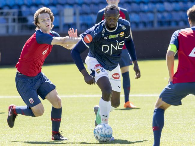 Jamaican sprint legend Usain Bolt (C) plays in a friendly in Norway. Picture: AFP