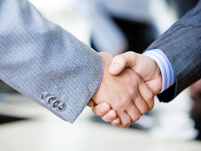 Close-up of two businessmen’s handshake