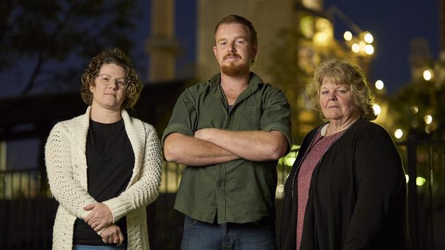 Lauren Francis, Sam Jackson and Vicki Easom are among dozens of residents who turned out to a town-hall meeting with Adbri concerning its Birkenhead factory, pictured in the background. Picture: Matt Loxton