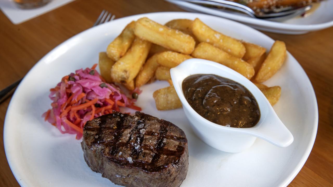 The eye fillets, chips and salad at the Regatta Hotel. Picture: Nigel Hallett