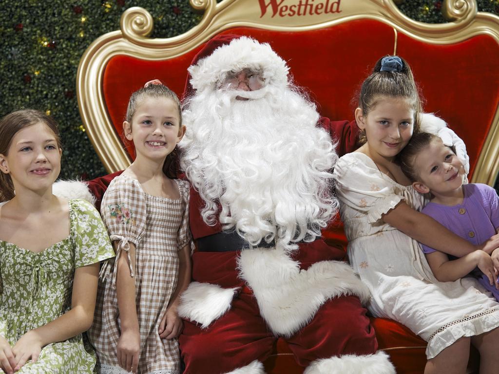 The Callaghan children — Vera, Lucinda, Ophelia and Esmeralda — meet Santa.