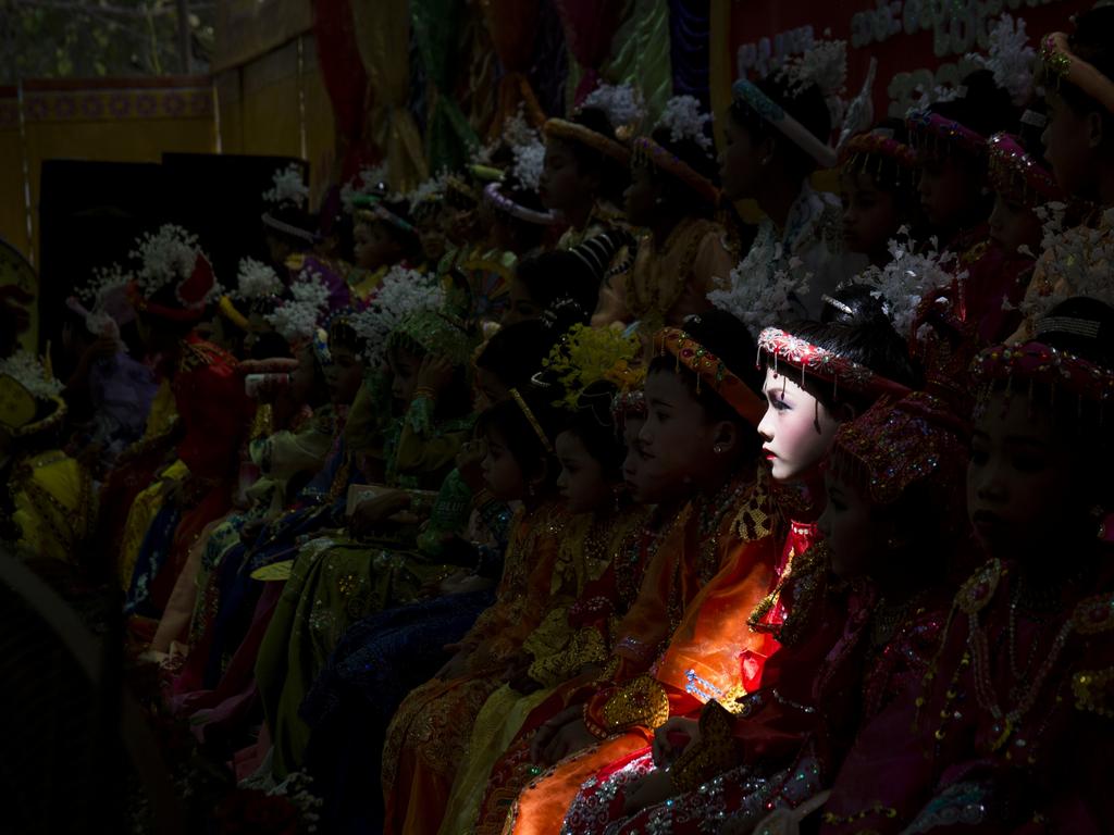 Image Name: Novice-monk-to-be Photographer Name: Sai Aung Main Year: 2018 Image Description: A novice-monk-to-be sits amongst others as they wait to begin an elaborate parade through town during a ceremony that will see them be inducted into a monastery or nunnery order in the village in Bagan, Myanmar.Buddhist tradition in Myanmar requires youths to spend some time in a monastery or nunnery before the age of 18 in what is viewed as an important coming of age ritual. Copyright: Sai Aung Main, Winner, Myanmar National Award. Picture: Sony World Photography Awards/ Sai Aung Main
