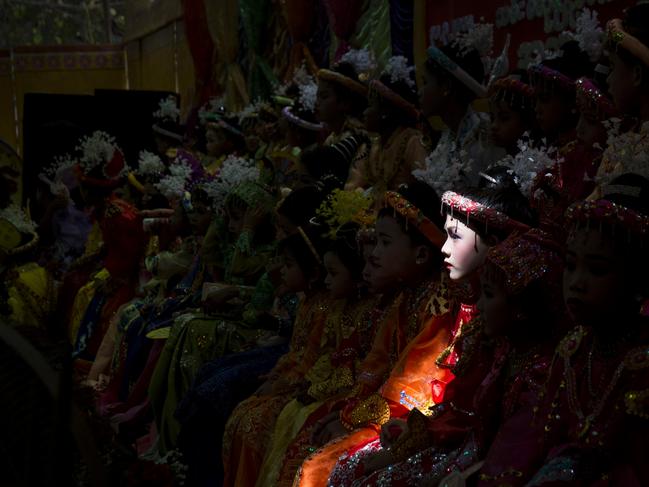 Image Name: Novice-monk-to-be Photographer Name: Sai Aung Main Year: 2018 Image Description: A novice-monk-to-be sits amongst others as they wait to begin an elaborate parade through town during a ceremony that will see them be inducted into a monastery or nunnery order in the village in Bagan, Myanmar.Buddhist tradition in Myanmar requires youths to spend some time in a monastery or nunnery before the age of 18 in what is viewed as an important coming of age ritual. Copyright: Sai Aung Main, Winner, Myanmar National Award. Picture: Sony World Photography Awards/ Sai Aung Main