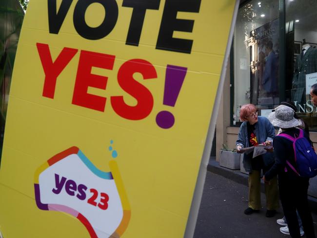 SYDNEY, AUSTRALIA - OCTOBER 09: A Yes23 campaigner hands out pamphlets outside a polling centre in the central business district on October 09, 2023 in Sydney, Australia. A referendum for Australians to decide on an indigenous voice to parliament will be held on October 14, 2023 and compels all Australians to vote by law. Early voting began on Oct. 2, with voting getting underway in all states. (Photo by Lisa Maree Williams/Getty Images)