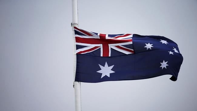 The Australian flag should be flown at half mast on Australia Day, an indigenous Melbourne MP says.