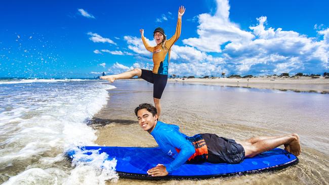 Get Wet Surf School instructor Samantha Jekyll with student Thomas Barry at The Spit on the Gold Coast. Picture: Nigel Hallett