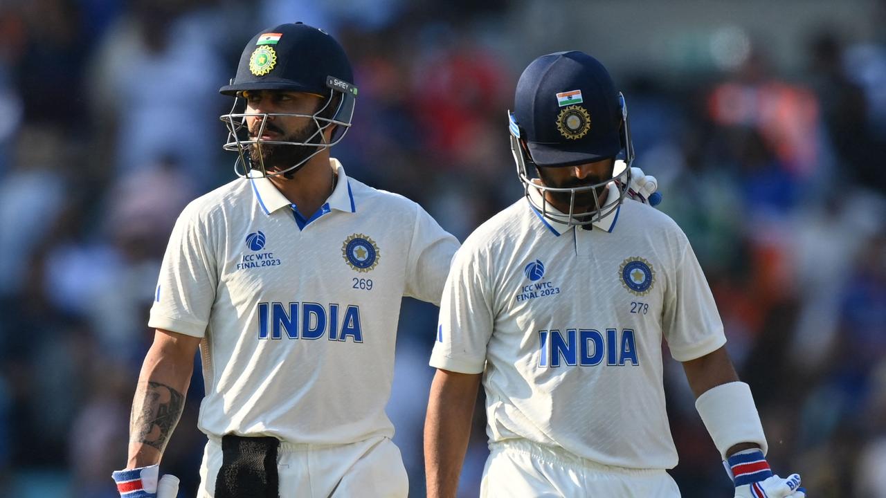 Virat Kohli (L) and Ajinkya Rahane will have their work cut out for them in chasing a world-record total. (Photo by Glyn KIRK / AFP)