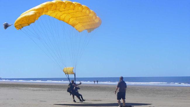 Natasha lands with   Skydive Capricorn  instructor Lloyd Cofield. Picture: Contributed