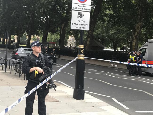 Police patrol on Millbank, in central London, after a car crashed into security barriers outside the Houses of Parliament. Picture: AP