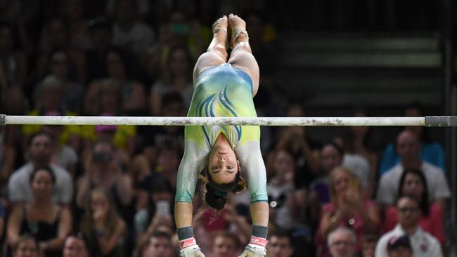 Australia's Georgia Godwin competes in the women's uneven bars final artistic gymnastics event during the 2018 Gold Coast Commonwealth Games at the Coomera Indoor Sports Centre on the Gold Coast on April 8, 2018. / AFP PHOTO / WILLIAM WEST