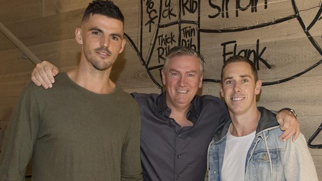 McGuire with 2010 captain Nick Maxwell and present skipper Scott Pendlebury. Picture: Michael Klein