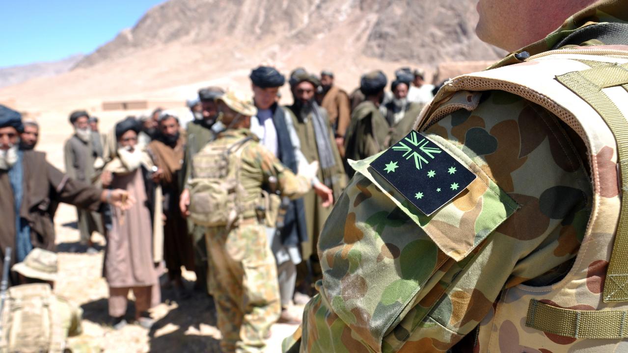 Australian Army soldiers from Special Operations Task Group welcome local Afghan government officials to a ‘shura’ (town meeting) to discuss security in the Gizab area of Uruzgan province, southern Afghanistan, in April 2010. Picture: Department of Defence