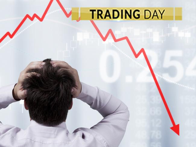 Businessman standing in front of the panel with financial statistics