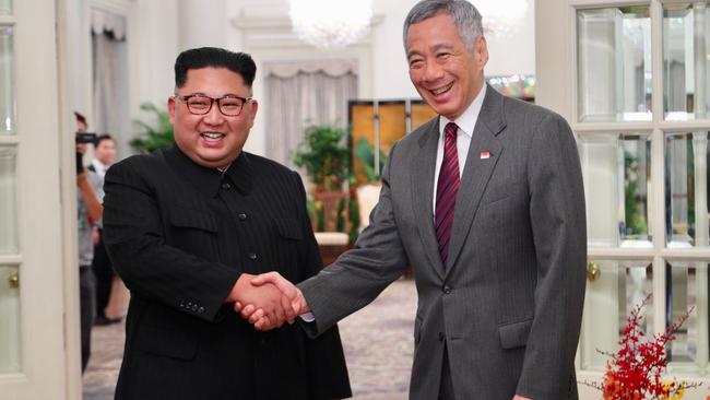 Kim Jong-un shaking hands with Singapore's Prime Minister Lee Hsien Loong after their meeting.