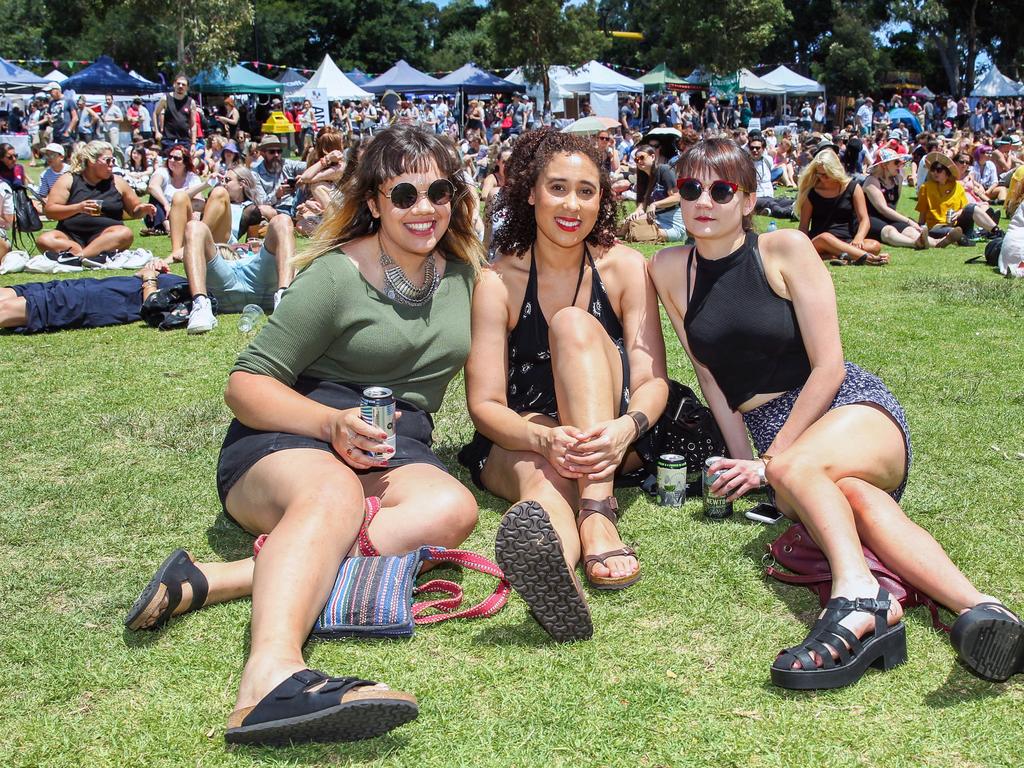 From left: Mira MacDonald, Alesandra Hernanez and Nadia Rosenthal relaxing at the Newtown Festival. Picture: Jess Husband.