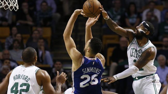 Boston Celtics’ Kyrie Irving blocks a shot by Philadelphia 76ers' Ben Simmons in Boston. Picture: AP