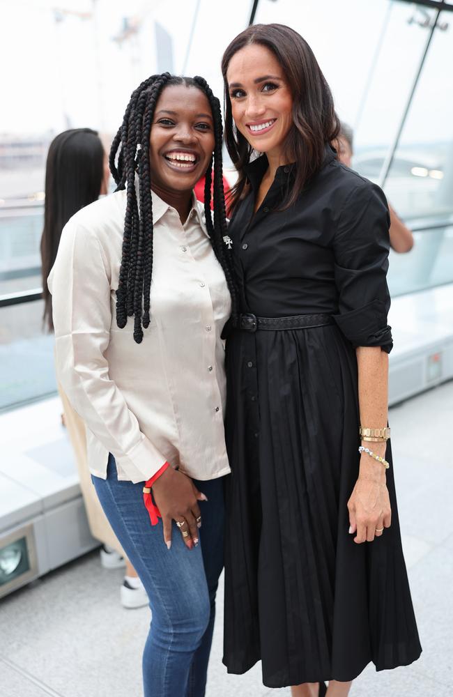 Meghan Markle with Nigerian athlete Glory Essien. Picture: Getty Images