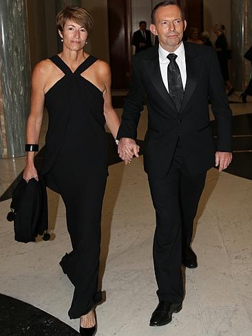 The Prime Minister Tony Abbott with his wife Margie, wearing a Simona black evening dress, arrive for the Mid Winter Ball. Pic by Gary Ramage