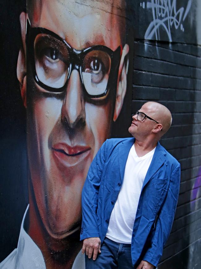 Heston Blumenthal admires a street art painting of himself outside Chin Chin in Melbourne.