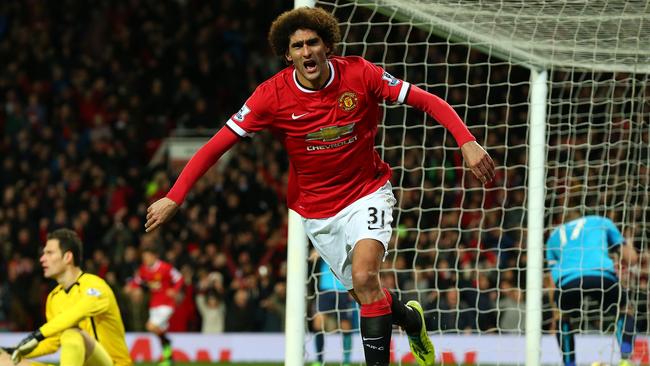 Marouane Fellaini celebrates scoring the first goal for Manchester United.