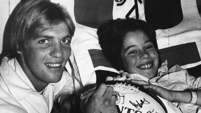 Trevor Barker visiting a sick St Kilda fan in hospital in 1981.